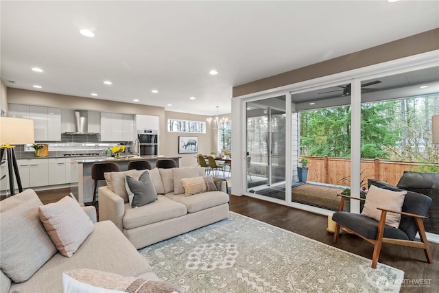 24014 Lily Pl SE, Black Diamond, WA 98010 - living area featuring dark wood finished floors, recessed lighting, and a chandelier