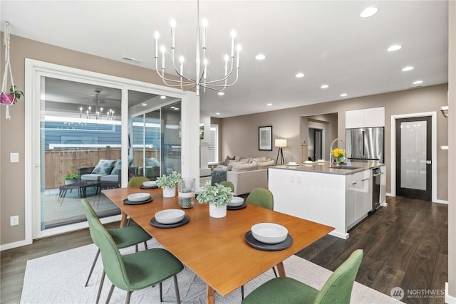 24014 Lily Pl SE, Black Diamond, WA 98010 - dining space with a chandelier, dark wood-style flooring, recessed lighting, and baseboards