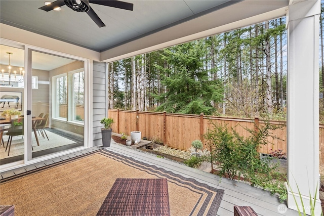 24014 Lily Pl SE, Black Diamond, WA 98010 - unfurnished sunroom featuring ceiling fan and a chandelier