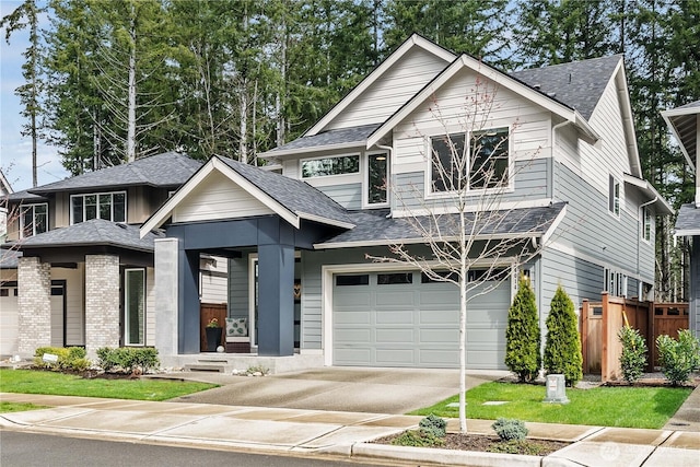 24014 Lily Pl SE, Black Diamond, WA 98010 - view of front of home featuring fence, roof with shingles, driveway, and a garage