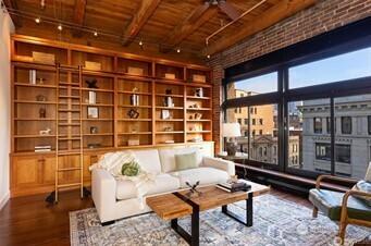sitting room with beamed ceiling, ceiling fan, wood finished floors, and wood ceiling