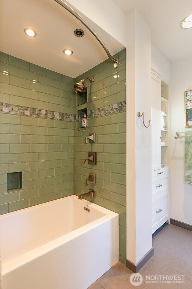 bathroom with baseboards, shower / bathing tub combination, and recessed lighting