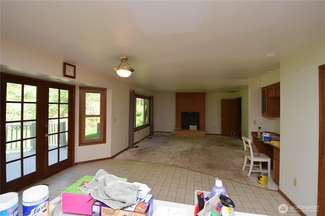 13029 322nd Ave NE, Duvall, WA 98019 - unfurnished living room with a large fireplace, baseboards, and french doors