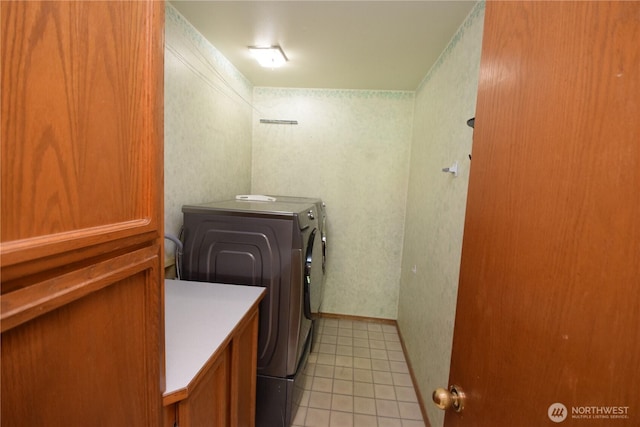 13029 322nd Ave NE, Duvall, WA 98019 - washroom featuring light tile patterned floors, washing machine and dryer, and cabinet space