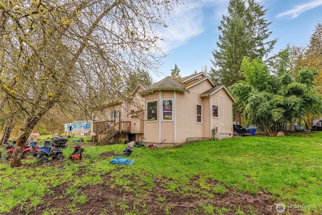 view of home's exterior with a yard