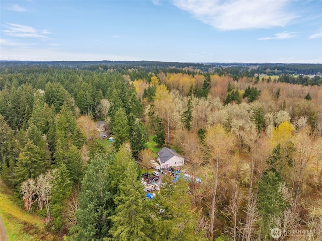 drone / aerial view with a view of trees