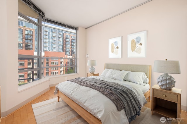 bedroom with wood finished floors