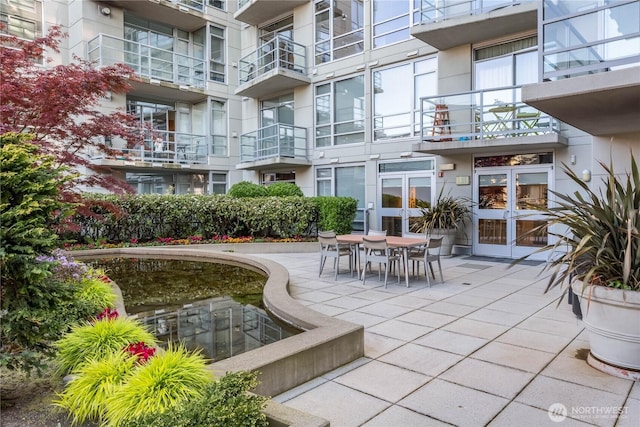 surrounding community featuring a patio