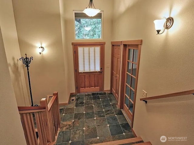 41 Rocky Ridge Dr, Bellingham, WA 98229 - foyer entrance featuring baseboards, a towering ceiling, and stone finish flooring