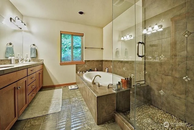 41 Rocky Ridge Dr, Bellingham, WA 98229 - bathroom featuring a sink, a shower stall, a bath, baseboards, and double vanity