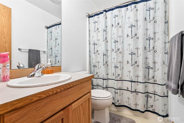 full bath with toilet and vanity