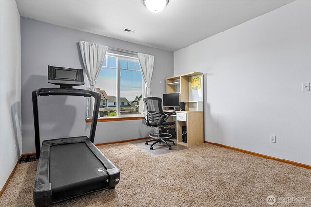 office space featuring baseboards and carpet
