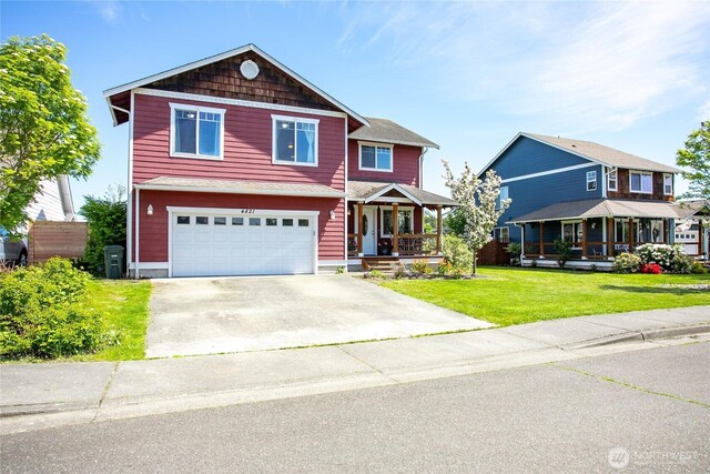craftsman house featuring a porch, a front lawn, an attached garage, and driveway