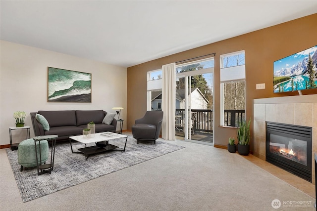 9423 18th Ave W Unit A, Everett, WA 98204 - living room featuring a tile fireplace, carpet flooring, and baseboards