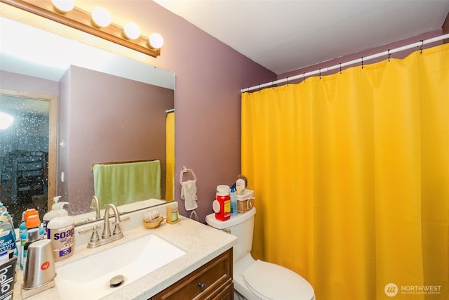 full bath with toilet and vanity