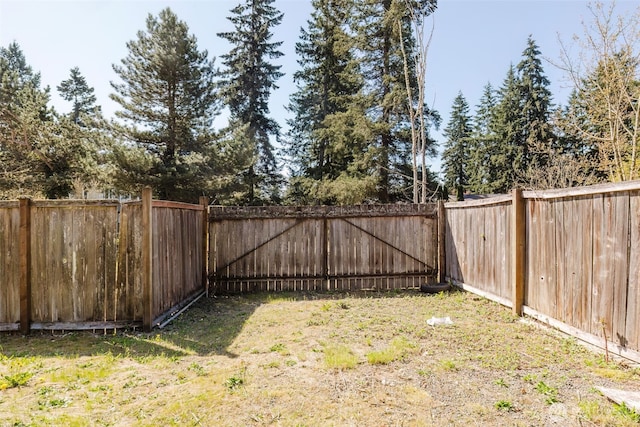 view of yard featuring a fenced backyard