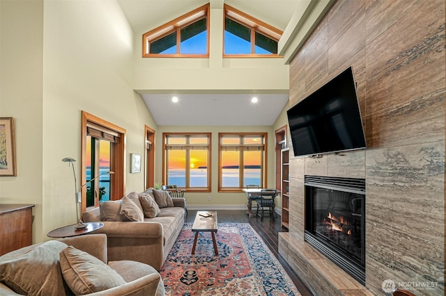9535 Semiahmoo Pkwy Unit B305, Blaine, WA 98230 - living room featuring recessed lighting, high vaulted ceiling, baseboards, dark wood finished floors, and a tiled fireplace