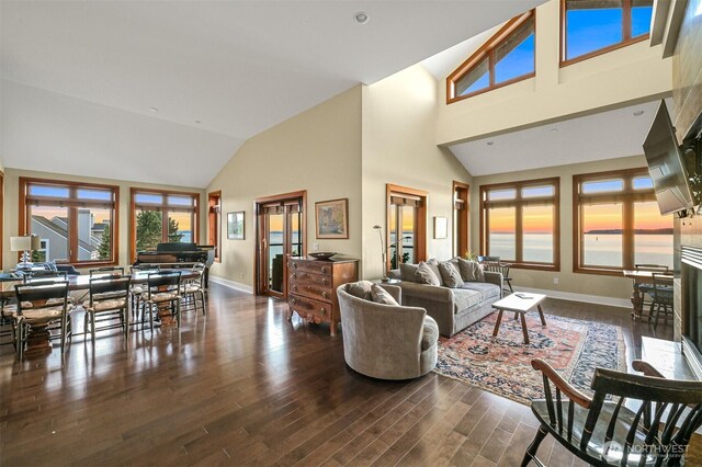 9535 Semiahmoo Pkwy Unit B305, Blaine, WA 98230 - living area with high vaulted ceiling, baseboards, and wood finished floors