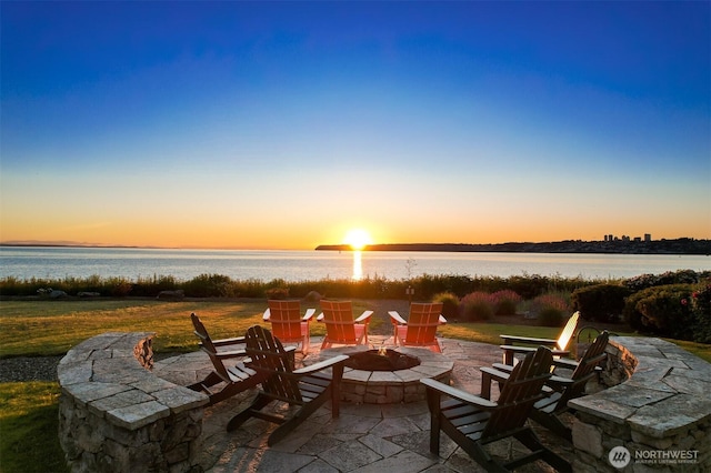 9535 Semiahmoo Pkwy Unit B305, Blaine, WA 98230 - patio terrace at dusk featuring a water view and an outdoor fire pit