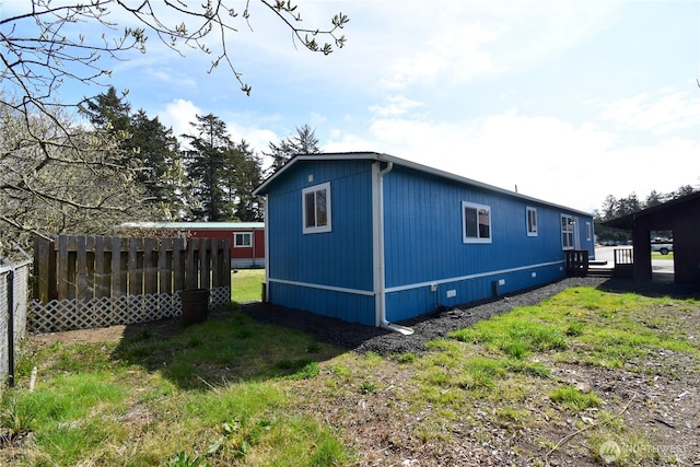 view of property exterior with fence
