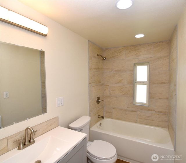bathroom with toilet, vanity, tub / shower combination, and recessed lighting