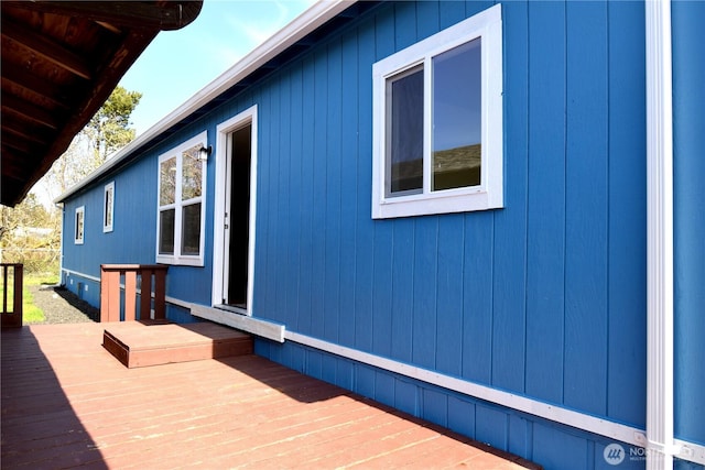 view of side of property featuring a deck