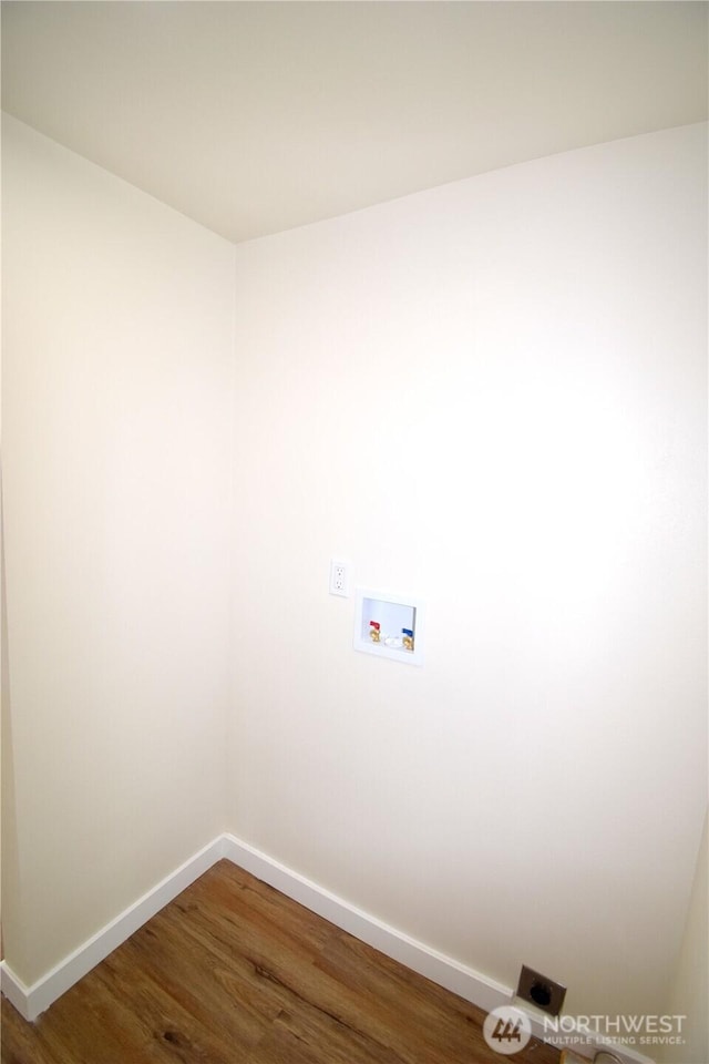 clothes washing area with washer hookup, wood finished floors, hookup for an electric dryer, laundry area, and baseboards