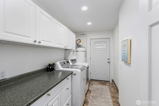 laundry area featuring water heater, washer and dryer, recessed lighting, and cabinet space