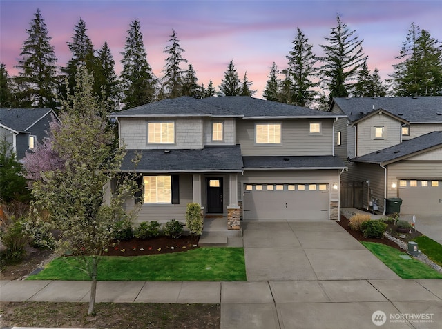 32904 SE Stevens St, Black Diamond, WA 98010 - view of front of property featuring driveway, stone siding, and a garage