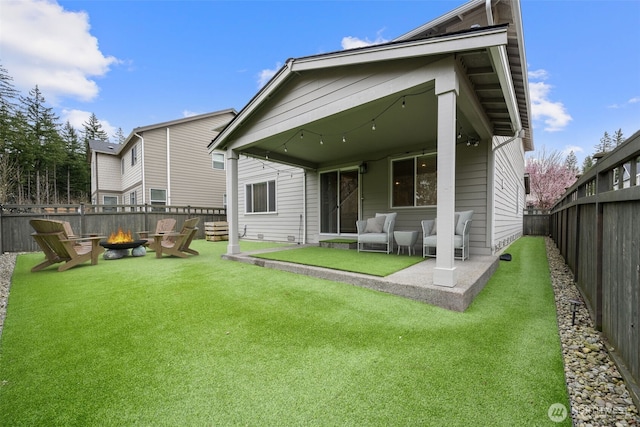 32904 SE Stevens St, Black Diamond, WA 98010 - back of property featuring a patio, a fire pit, a fenced backyard, and a yard