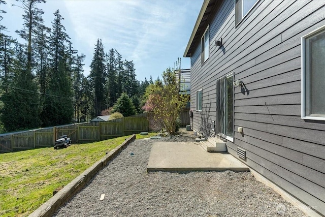 view of yard with a fenced backyard and a patio area