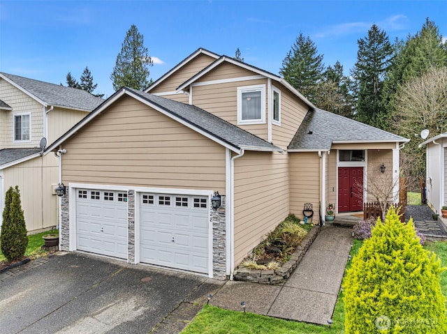 13328 67th Ave E, Puyallup, WA 98373 - view of front of property featuring stone siding, aphalt driveway, a garage, and a shingled roof
