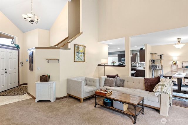 13328 67th Ave E, Puyallup, WA 98373 - carpeted living area featuring baseboards, high vaulted ceiling, an inviting chandelier, and tile patterned floors