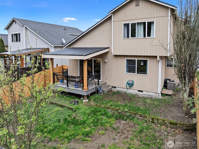 13328 67th Ave E, Puyallup, WA 98373 - back of property with cooling unit, a wooden deck, a shingled roof, crawl space, and a yard