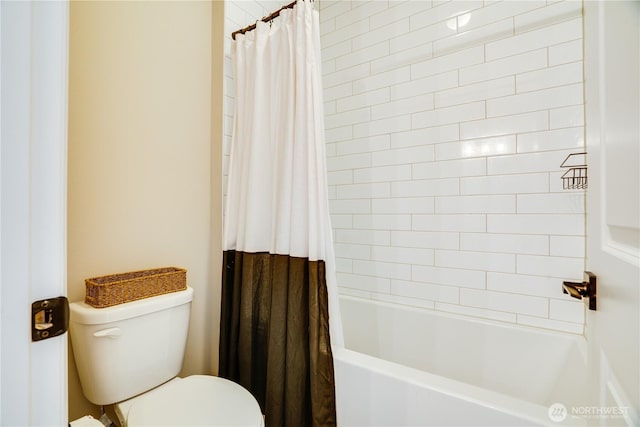 bathroom featuring shower / bathtub combination with curtain and toilet
