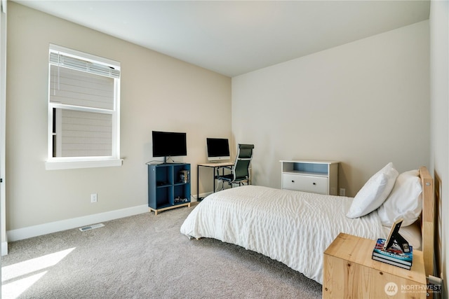 bedroom with baseboards, visible vents, and carpet floors