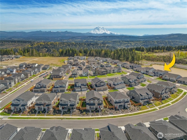 bird's eye view with a residential view and a mountain view