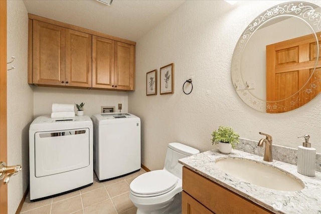 1129 235th Pl SW, Bothell, WA 98021 - half bathroom with washer and dryer, toilet, vanity, and tile patterned floors