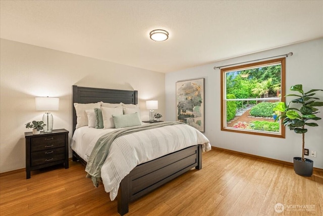 1129 235th Pl SW, Bothell, WA 98021 - bedroom featuring light wood-style floors and baseboards