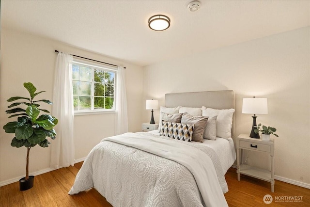 1129 235th Pl SW, Bothell, WA 98021 - bedroom featuring wood finished floors and baseboards