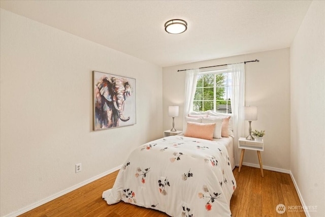 1129 235th Pl SW, Bothell, WA 98021 - bedroom featuring light wood-style floors and baseboards
