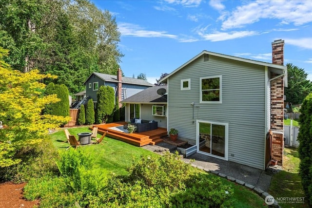 1129 235th Pl SW, Bothell, WA 98021 - back of house with a wooden deck, a chimney, and a yard