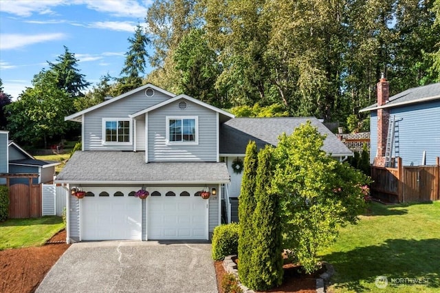 1129 235th Pl SW, Bothell, WA 98021 - view of front of house featuring a garage, asphalt driveway, and a shingled roof