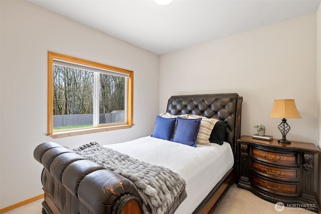 carpeted bedroom with baseboards