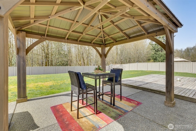 view of patio / terrace featuring a gazebo, a fenced backyard, and outdoor dining area