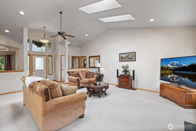 living room with baseboards, recessed lighting, carpet, and a skylight