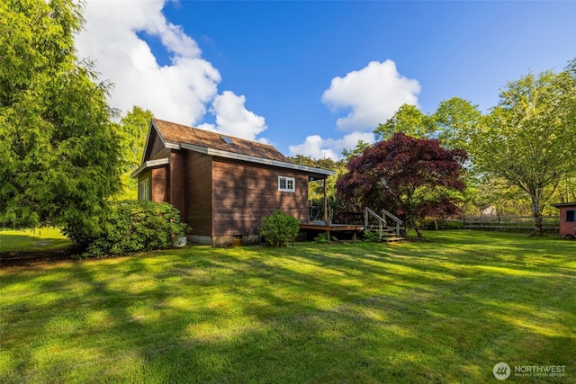 3404 Oysterville Rd, Oysterville, WA 98641 - rear view of property featuring fence, a wooden deck, and a yard