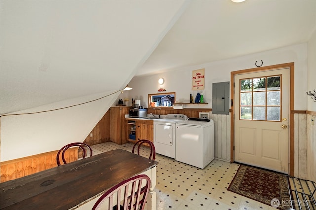 3404 Oysterville Rd, Oysterville, WA 98641 - kitchen with electric panel, vaulted ceiling, independent washer and dryer, light floors, and wainscoting