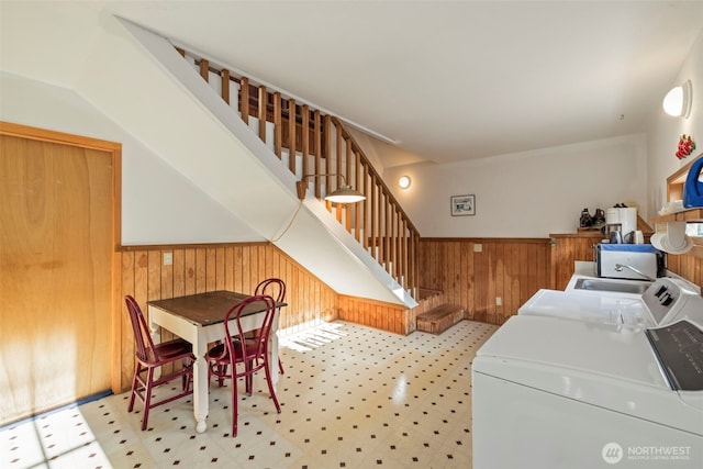 3404 Oysterville Rd, Oysterville, WA 98641 - laundry room with a wainscoted wall, laundry area, wood walls, and separate washer and dryer