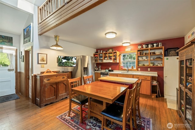 3404 Oysterville Rd, Oysterville, WA 98641 - dining space with light wood-style flooring and a wainscoted wall